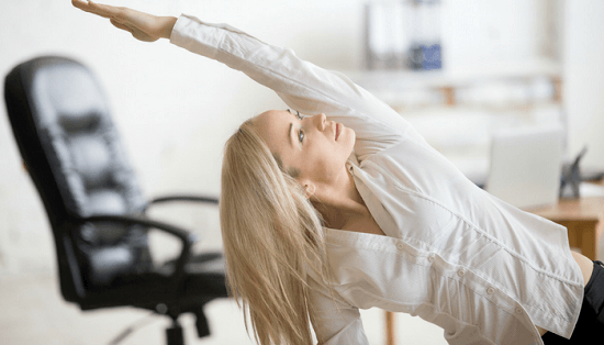 Woman doing yoga while at work