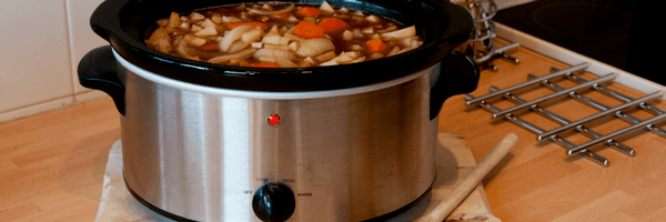 image of someone using a slow cooker as a healthy hack